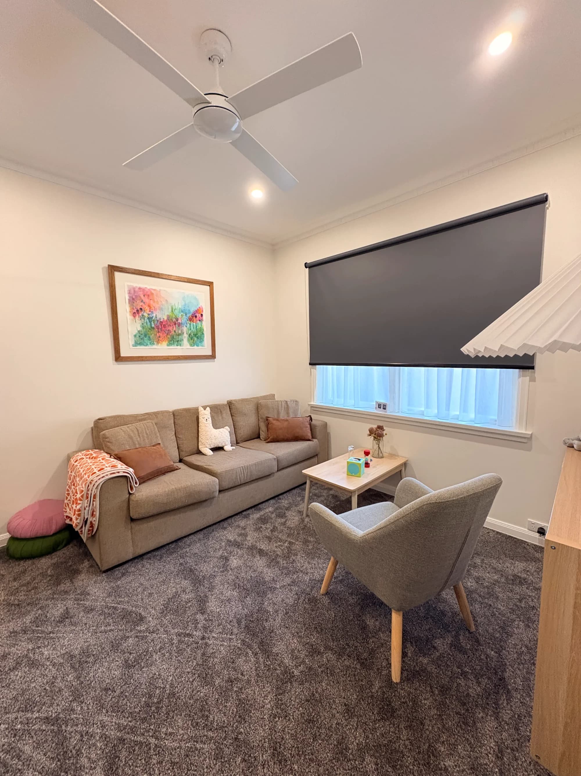 Bloom Well-being therapy room with couch and artwork in Creswick