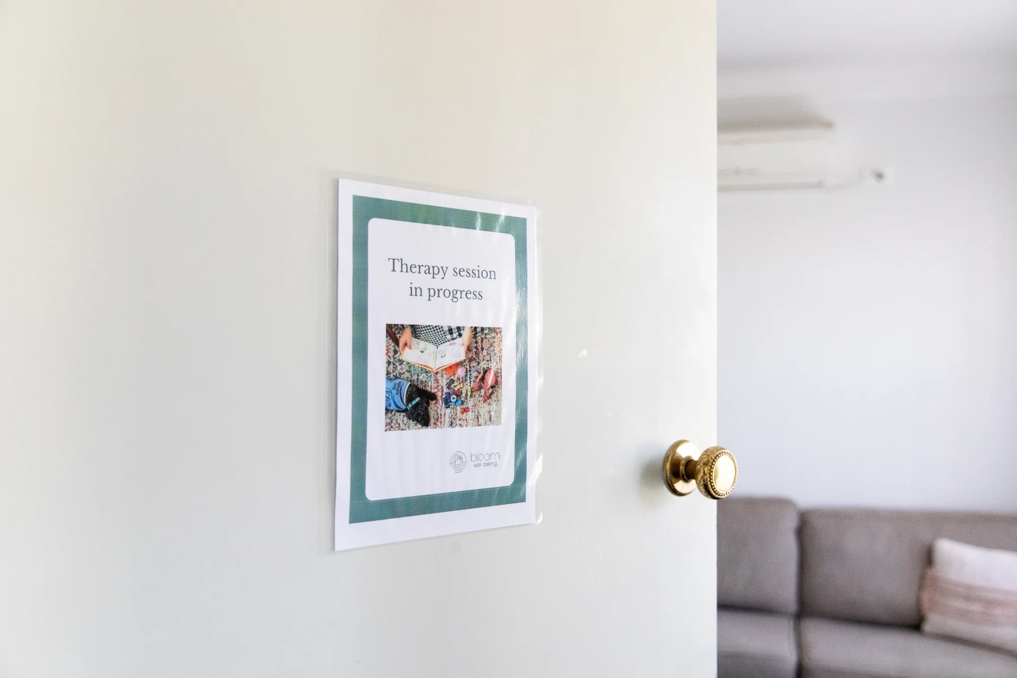 Therapy in session door sign at Bloom Well-being